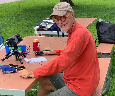 Ham radio operator enjoying portable Morse code operation outdoors